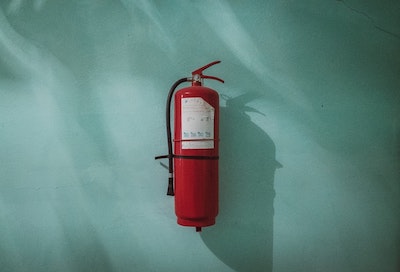 A fire extinguisher hanging on a wall